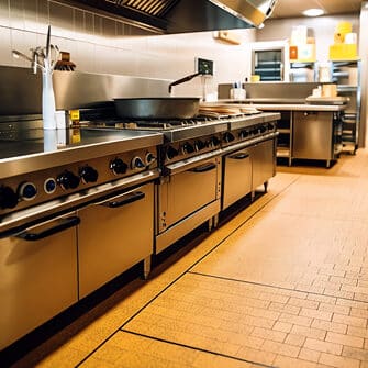 Clean, modern restaurant kitchen interior.